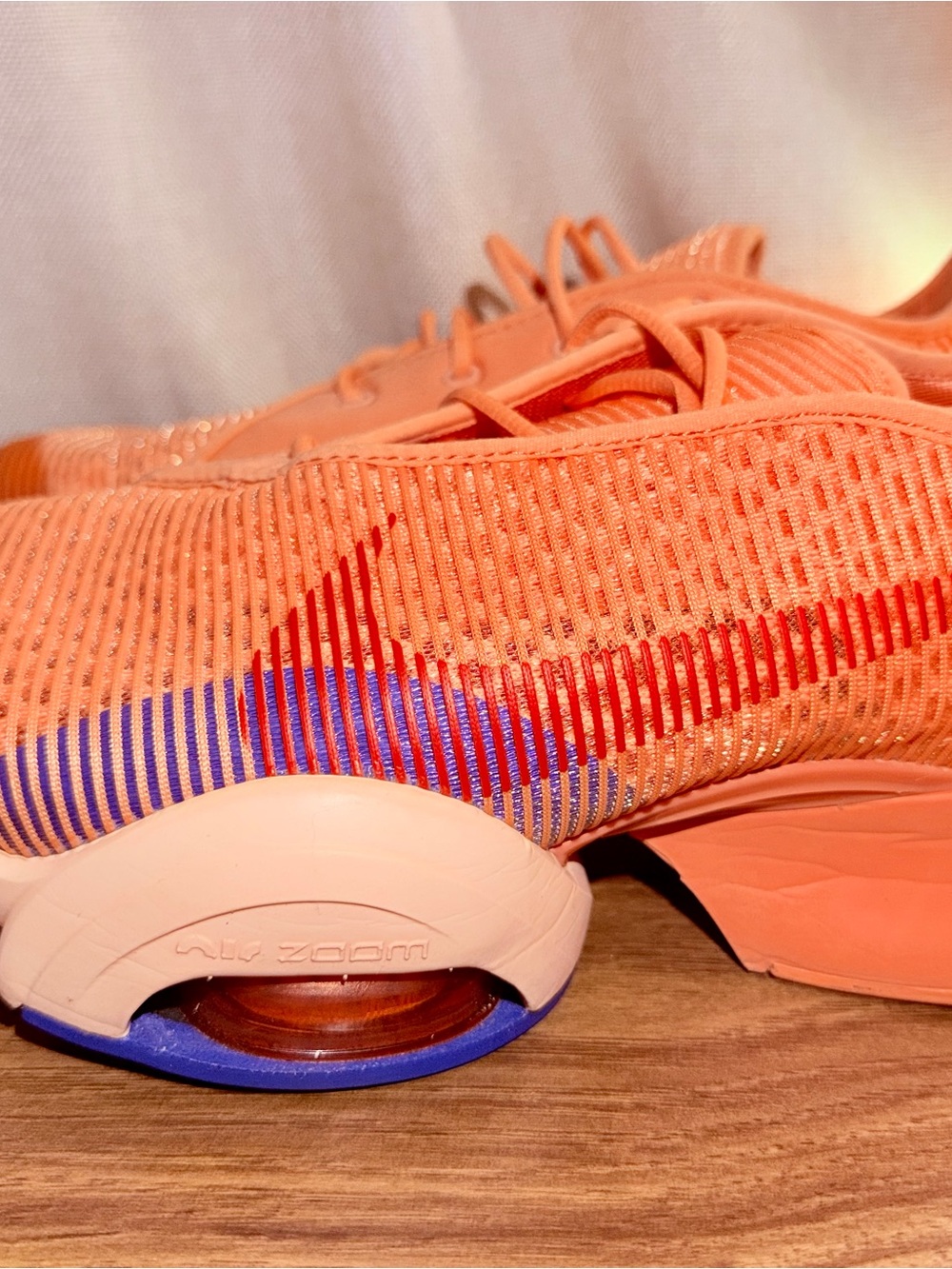 Nike Women's Coral/Red Athletic Running Shoes with Blue Accents